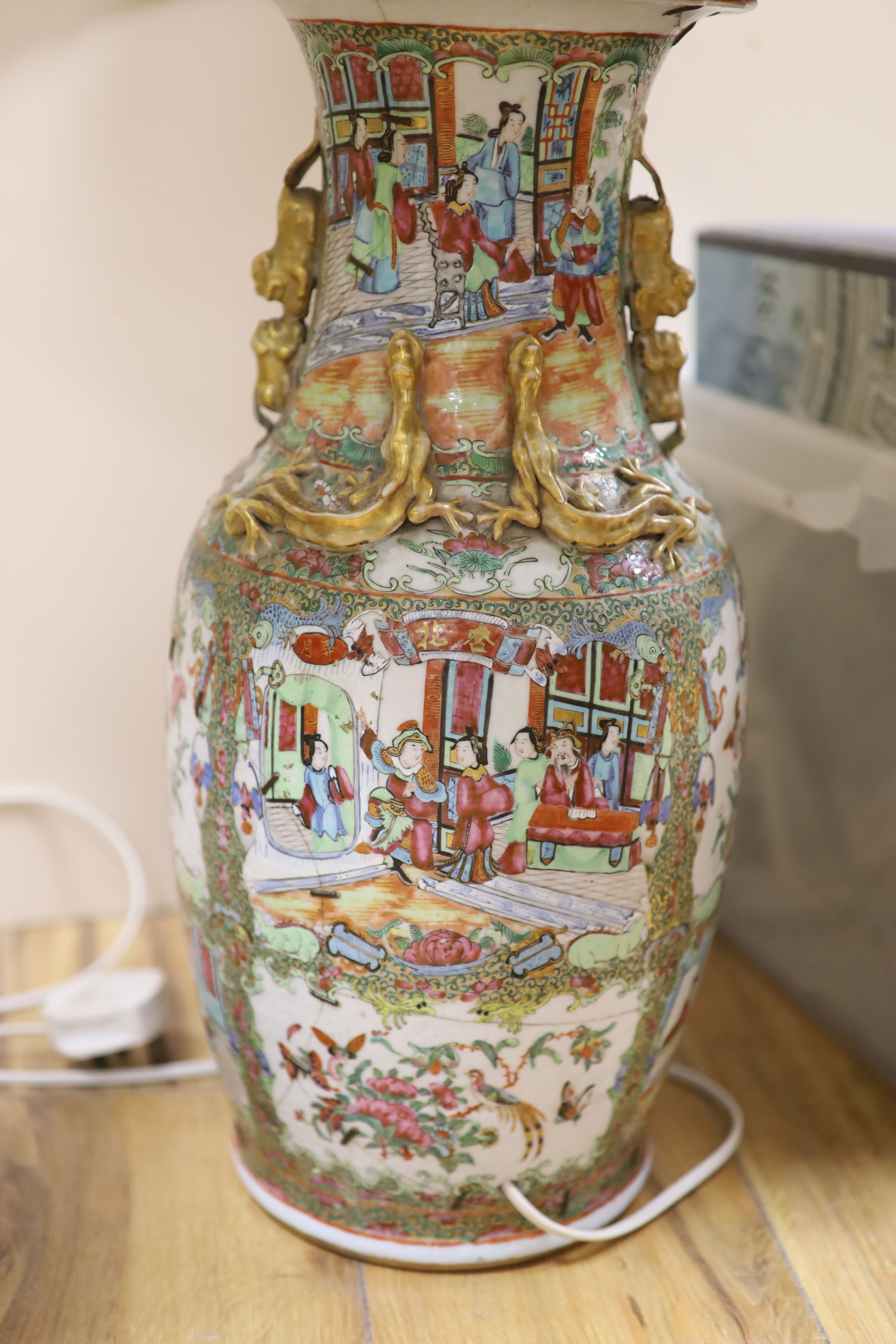 A pair of Chinese famille rose vases, mounted as lamps